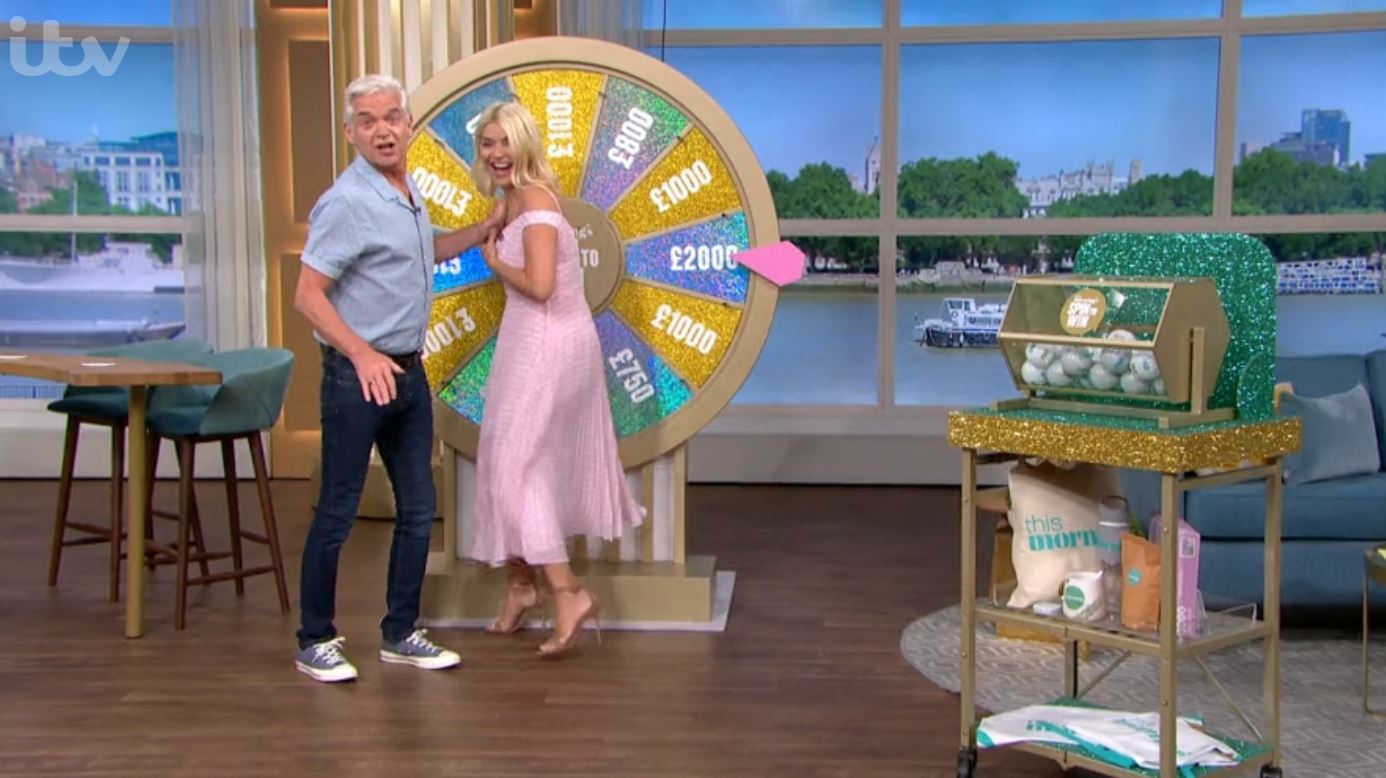 Phillip Schofield moves Holly out of the way