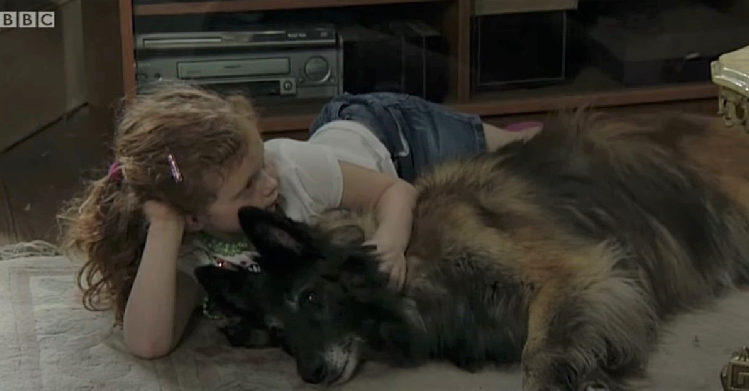 Wellard and Tiffany lie together on the floor in EastEnders