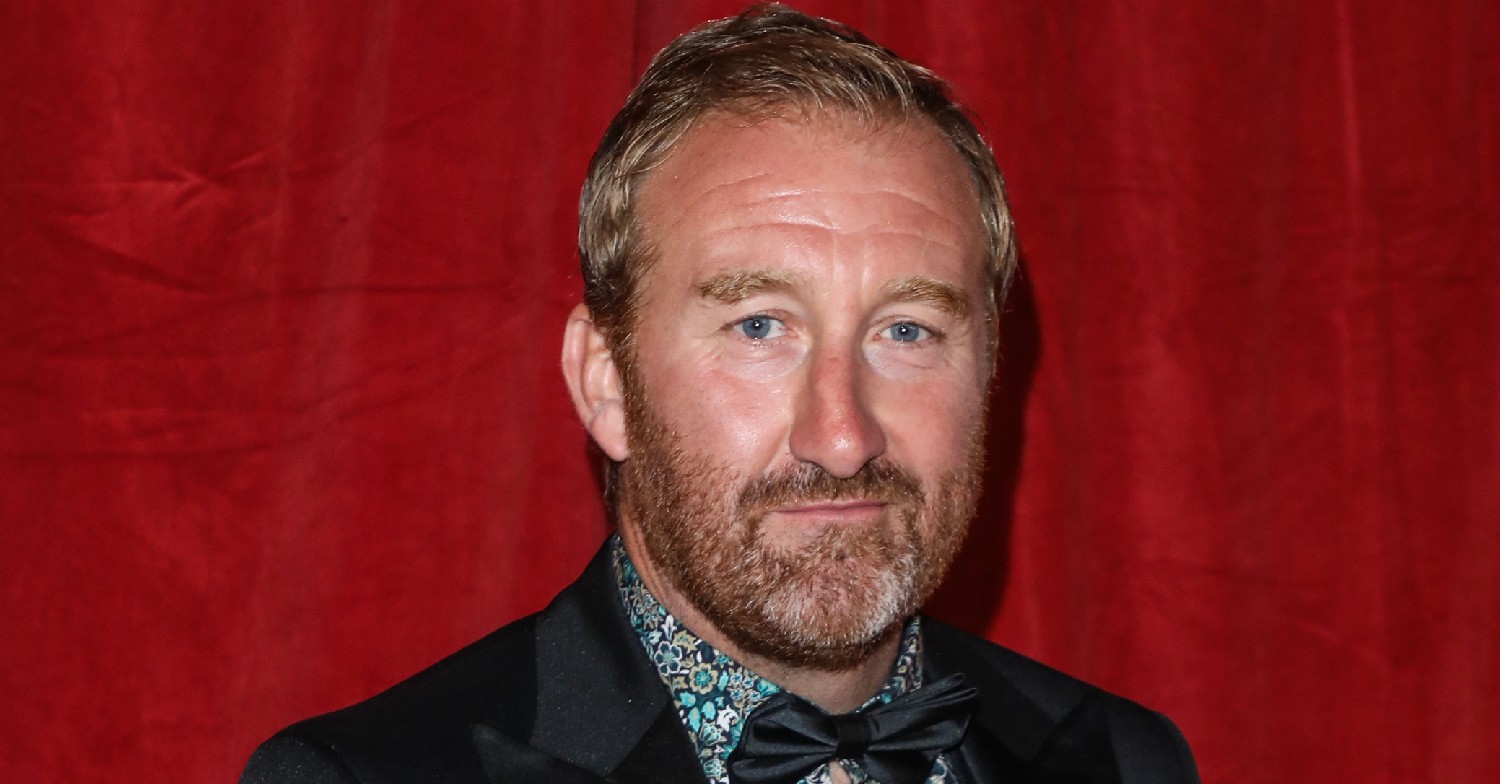 Coronation Street star Jamie Kenna smiling on the red carpet