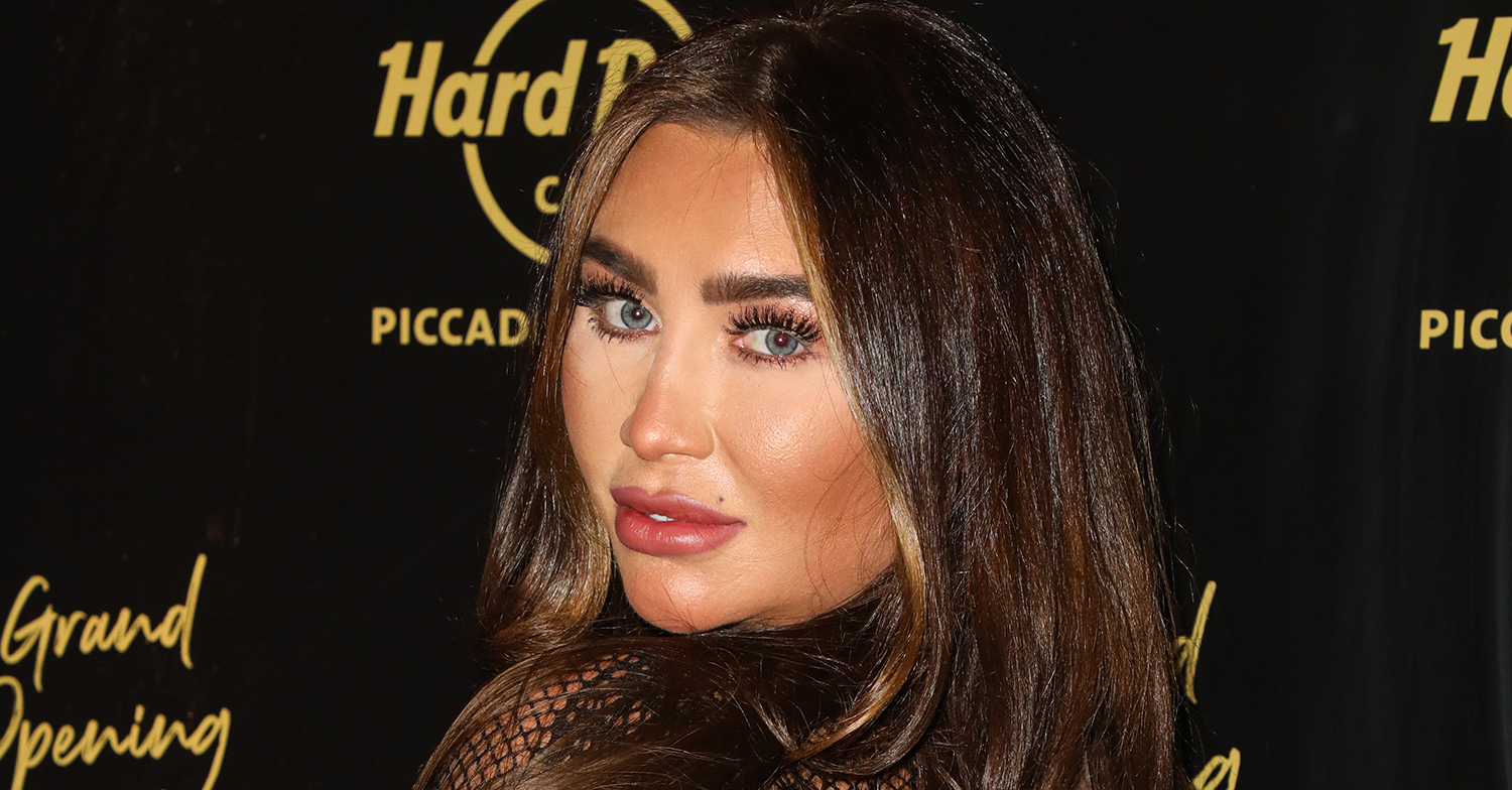 Lauren Goodger posing on the red carpet looking over her shoulder
