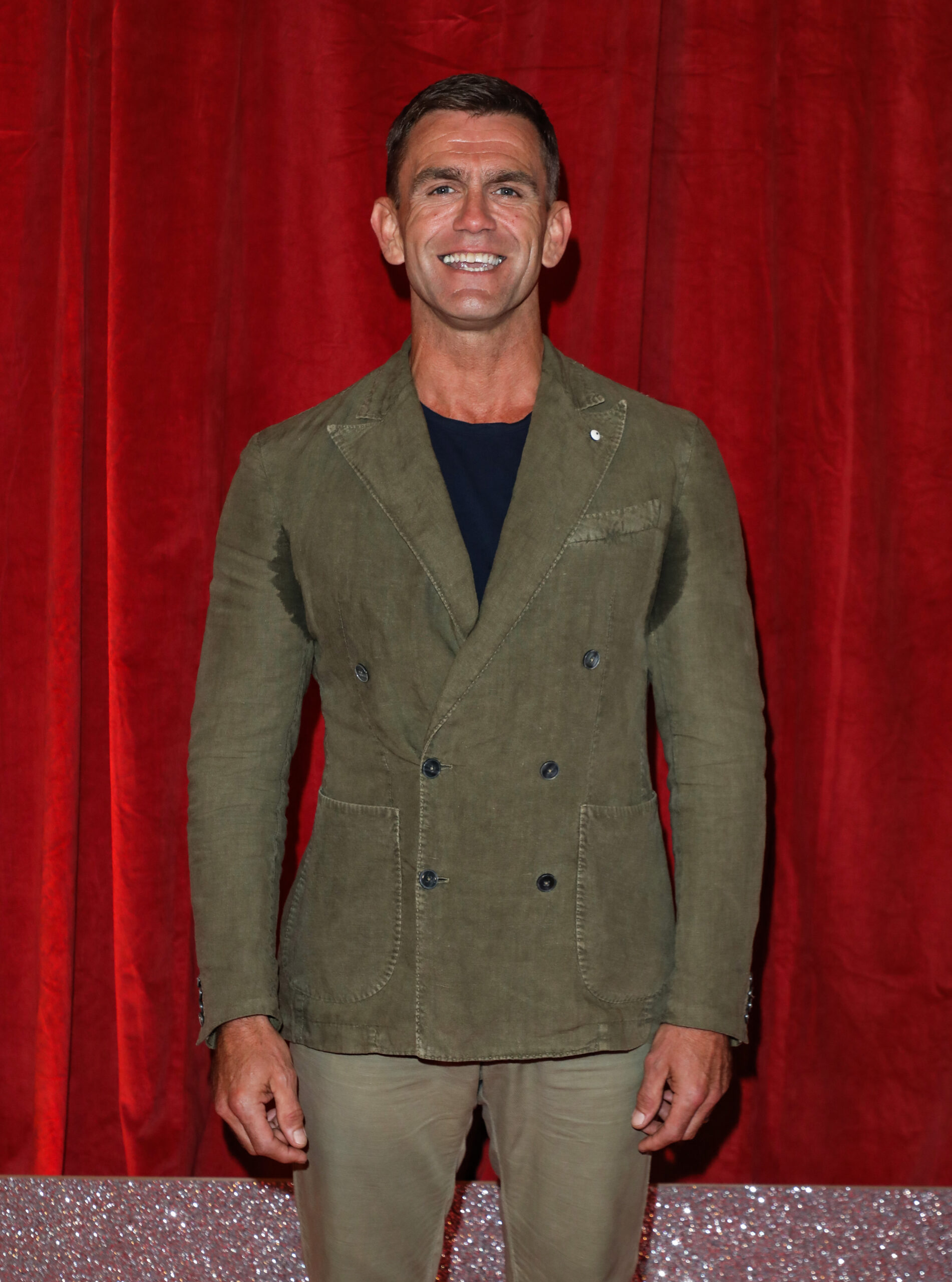 Scott Maslen smiling on the red carpet