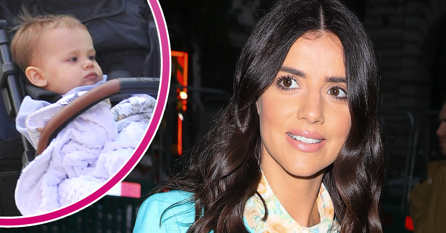 Lucy Mecklenburgh smiling and son Roman in a pram