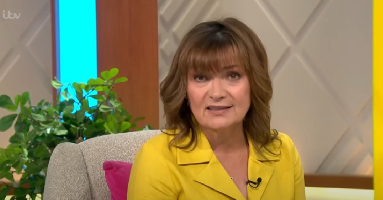 Lorraine Kelly in yellow dress looking at camera on ITV show
