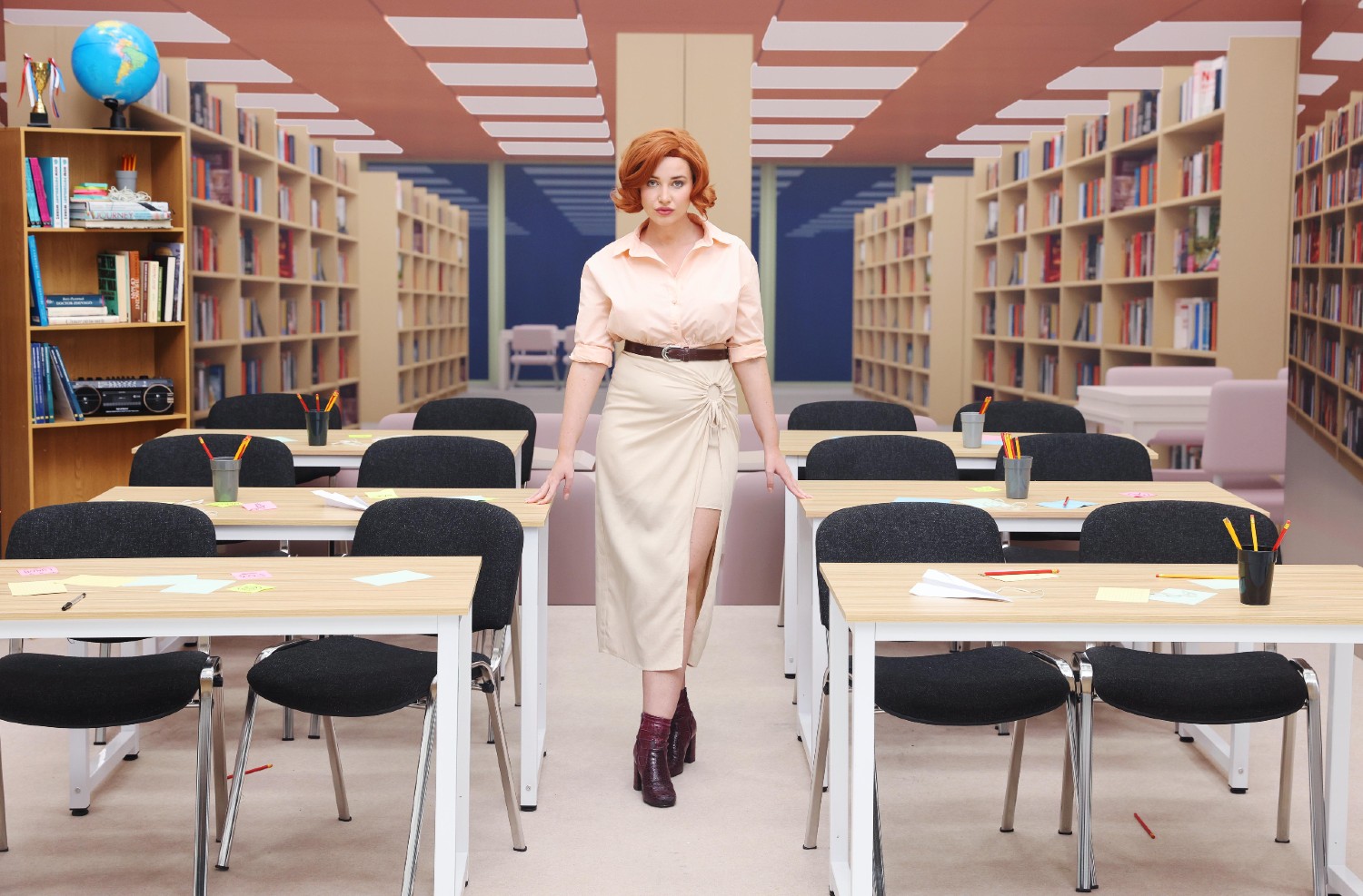 Amy Hart standing in The Breakfast Club library