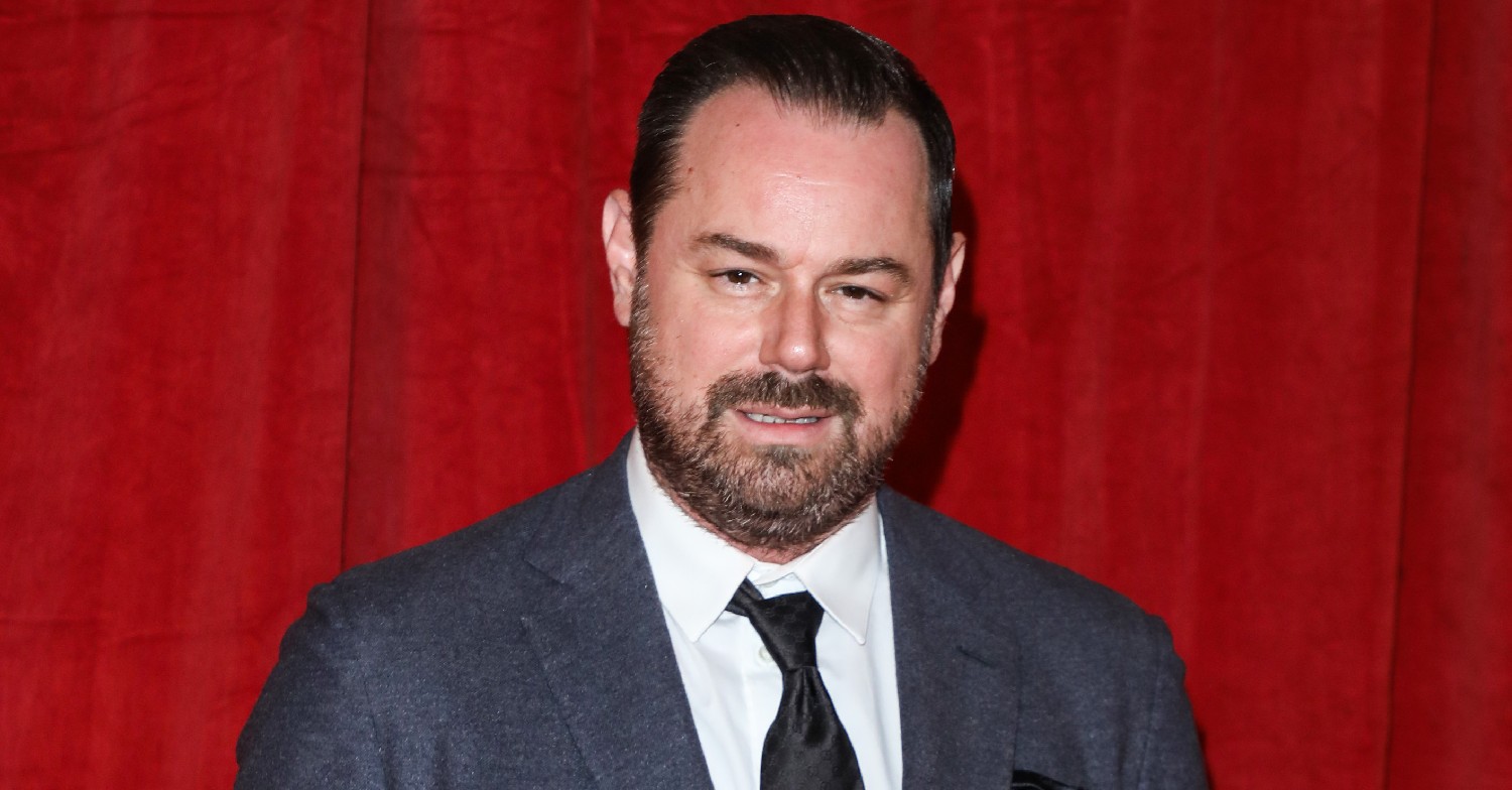 Danny Dyer smiling while wearing a suit