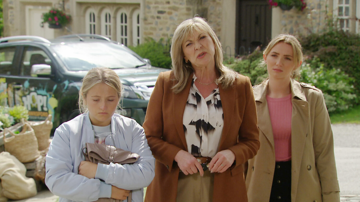 Emmerdale Amelia looks sheepish while Kim looks confused and Gabby annoyed