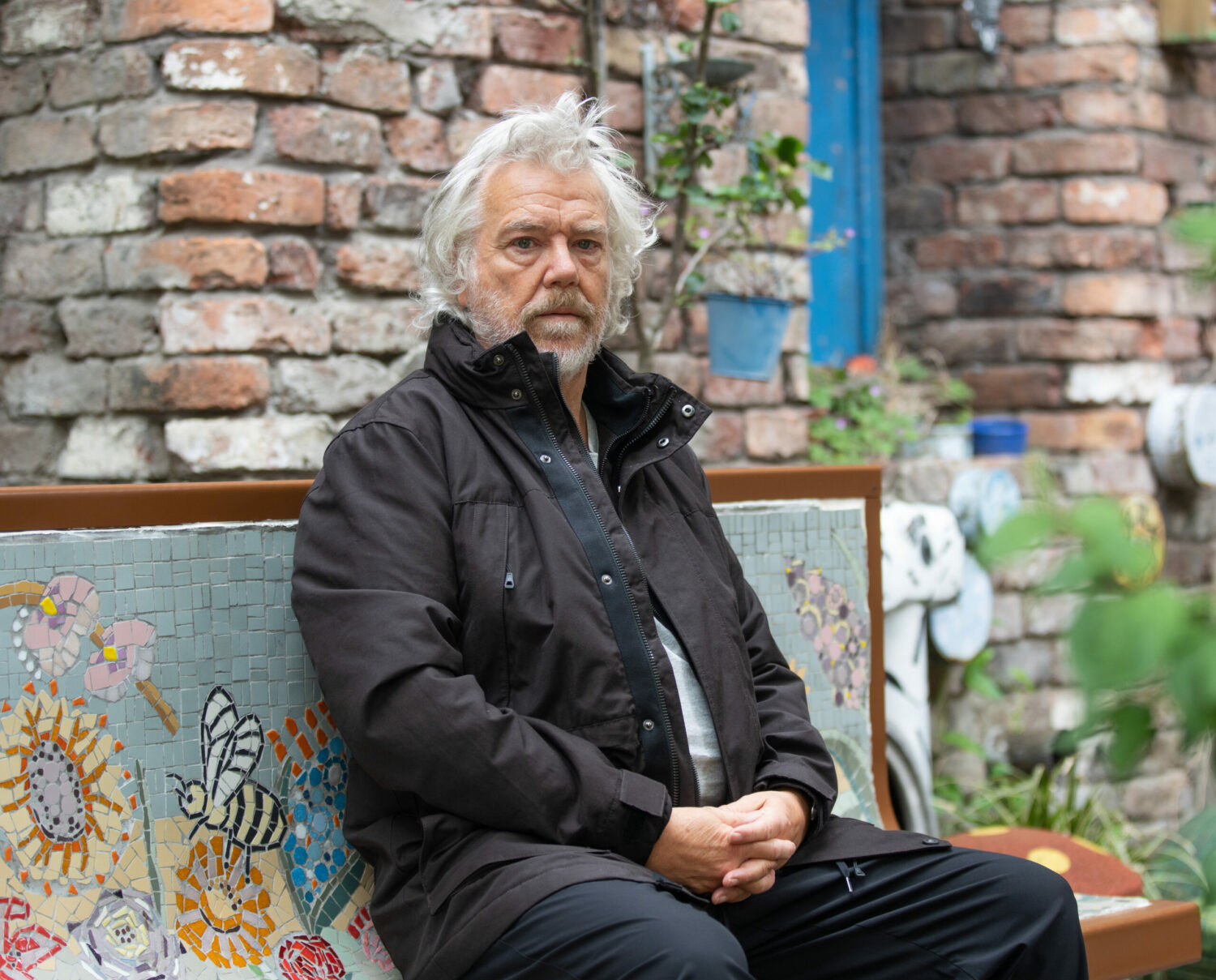 Coronation Street Stu looks downbeat in Victoria Garden