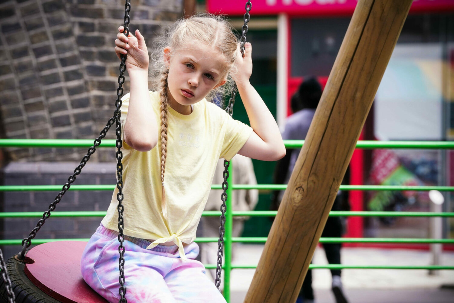 EastEnders Lexi is questioning on the swing