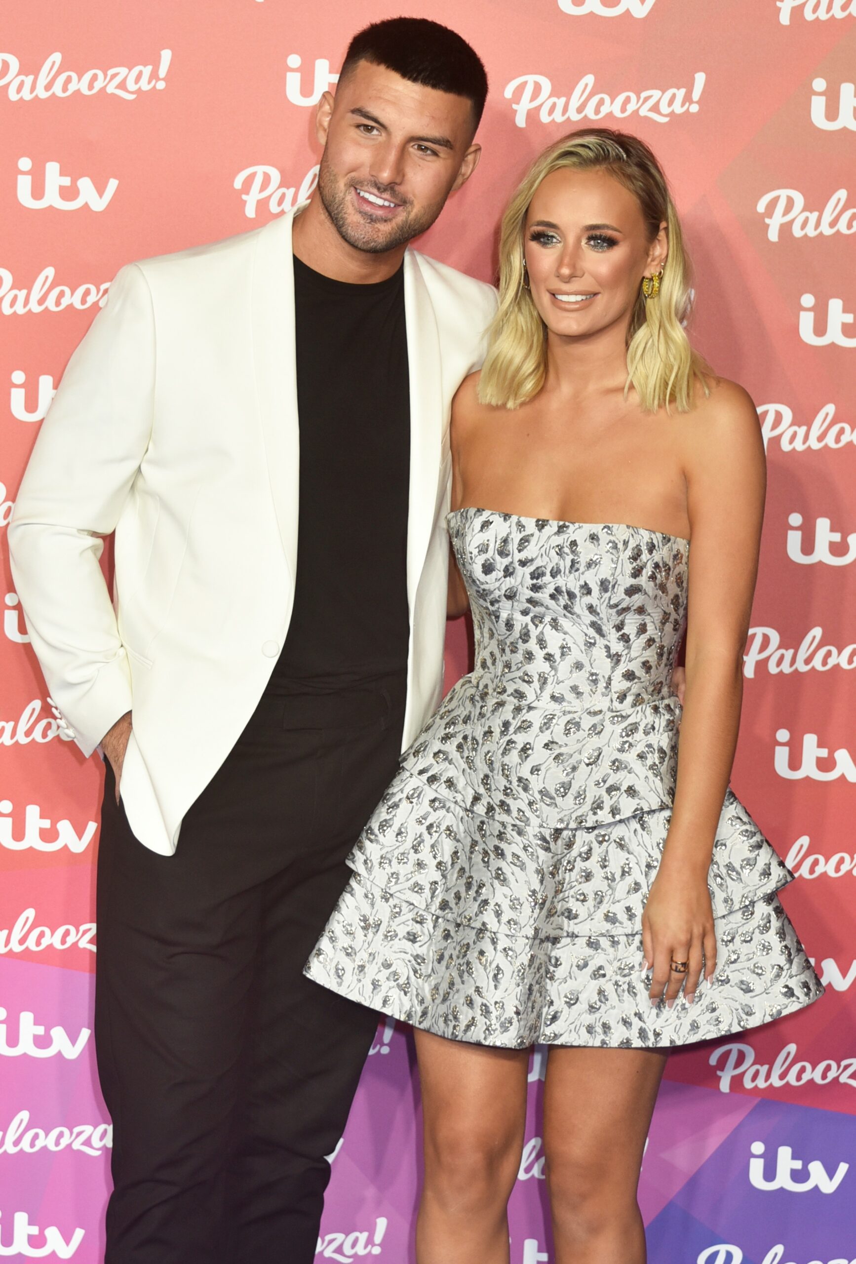 Love Island stars Liam and Millie smiling at ITV Palooza