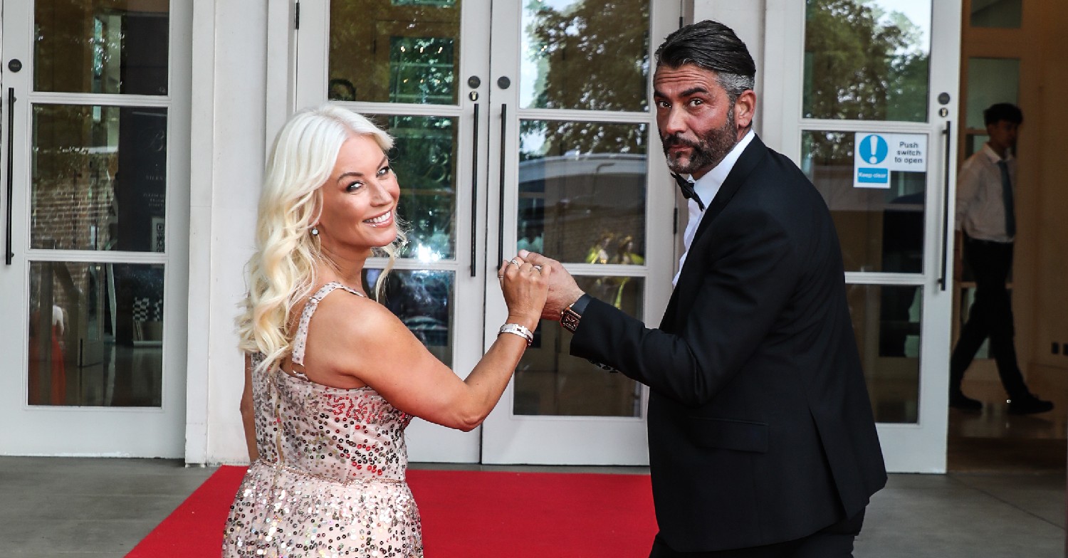 Denise Van Outen and new boyfriend Jimmy looking over their shoulders at the camera 