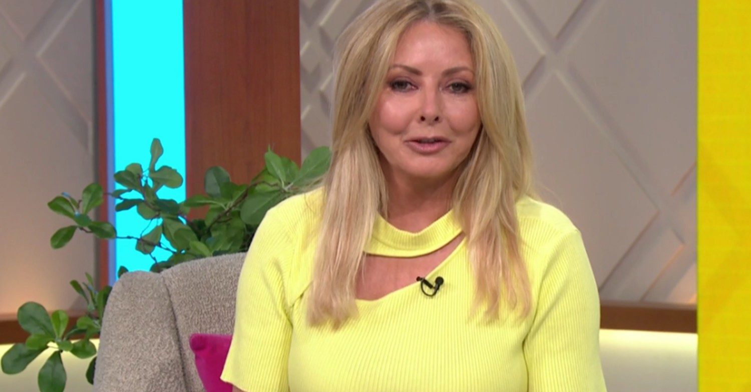 Carol Vorderman wearing bright yellow presenting on Lorraine
