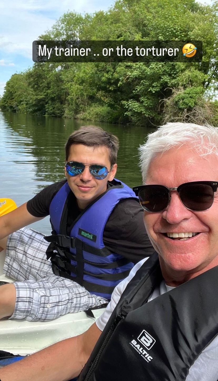 Phillip Schofield smiling with his trainer