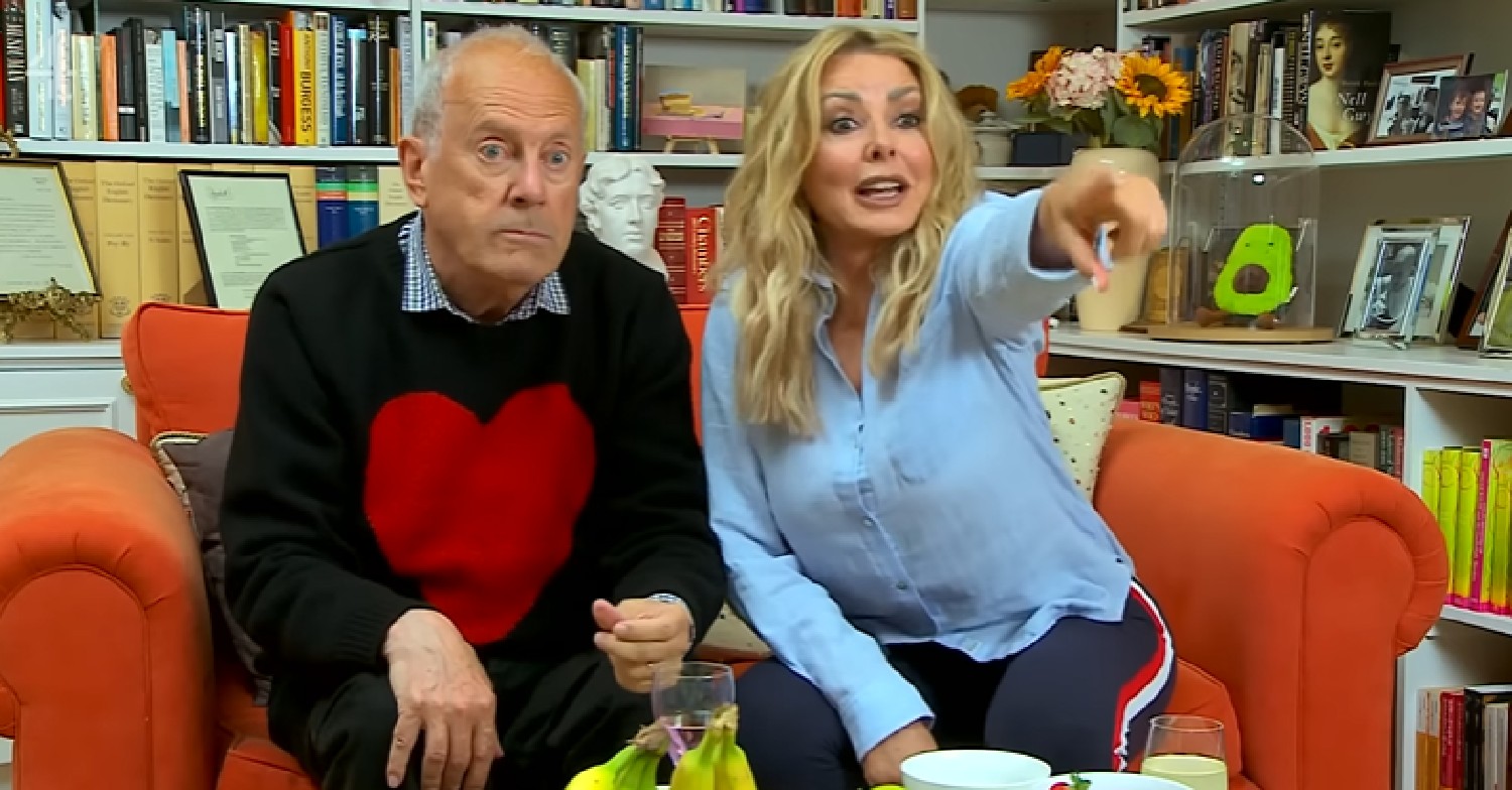Gyles Brandreth looks shocked as Carol Vorderman points at TV on Celebrity Gogglebox