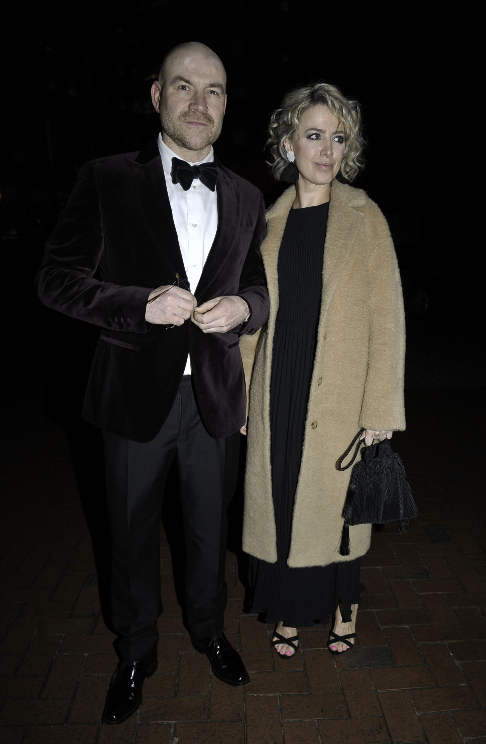 Joe Duttine and Sally Carman smile on night out