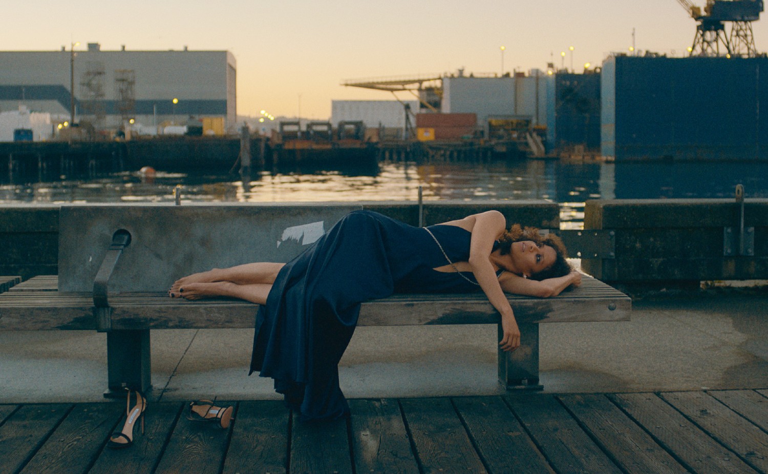 Gugu Mbatha-Raw laying down in a blue dress on Surface