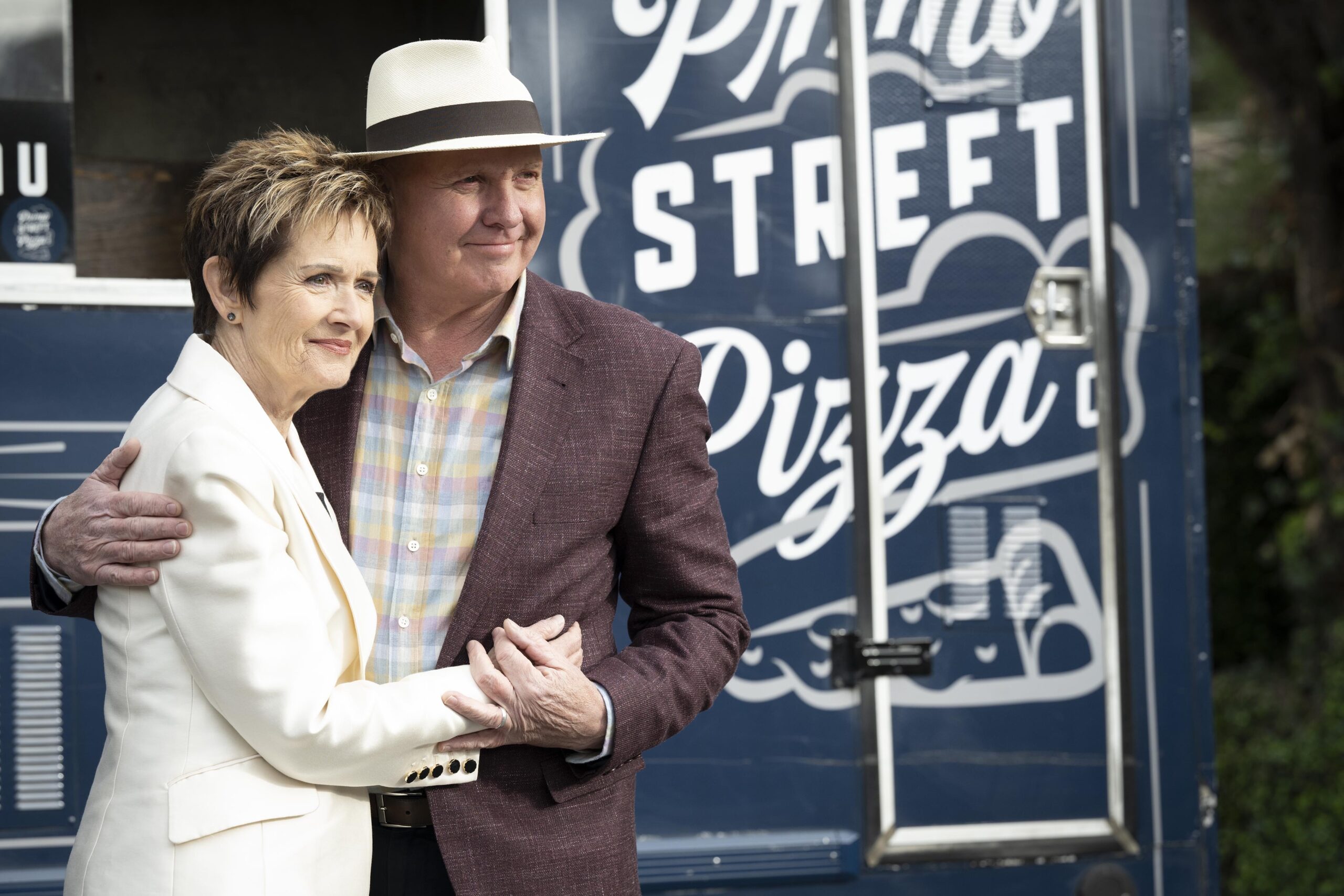 Neighbours Susan and Karl Kennedy hug as they look wistful