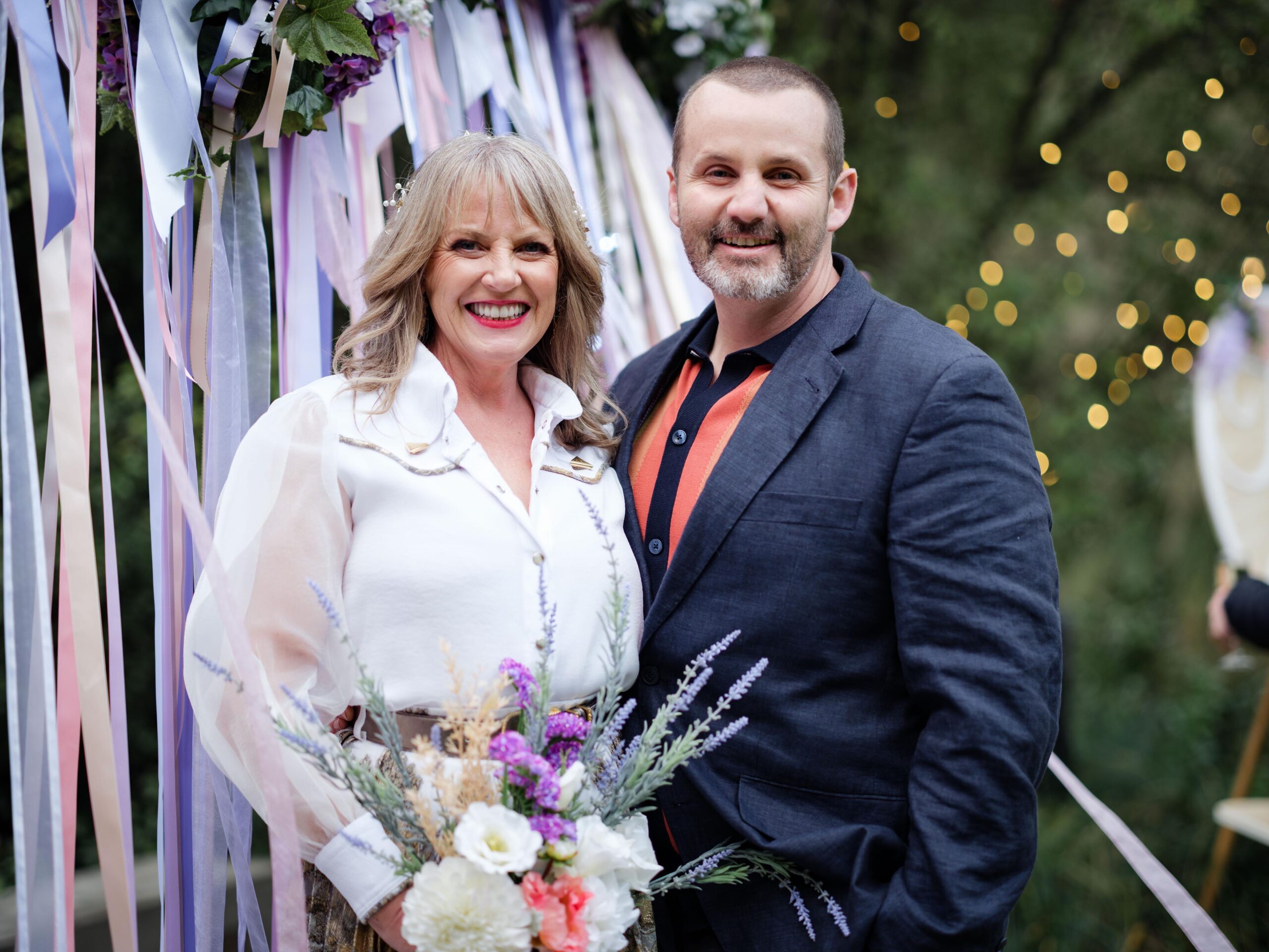 Neighbours Melanie and Toadie smile as they get married