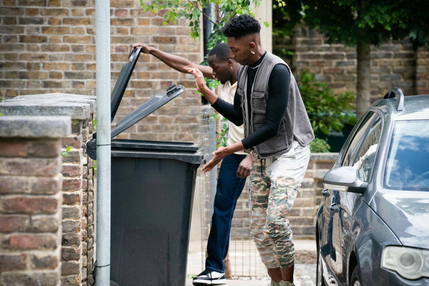 EastEnders Felix and Finlay look in the bins for the money
