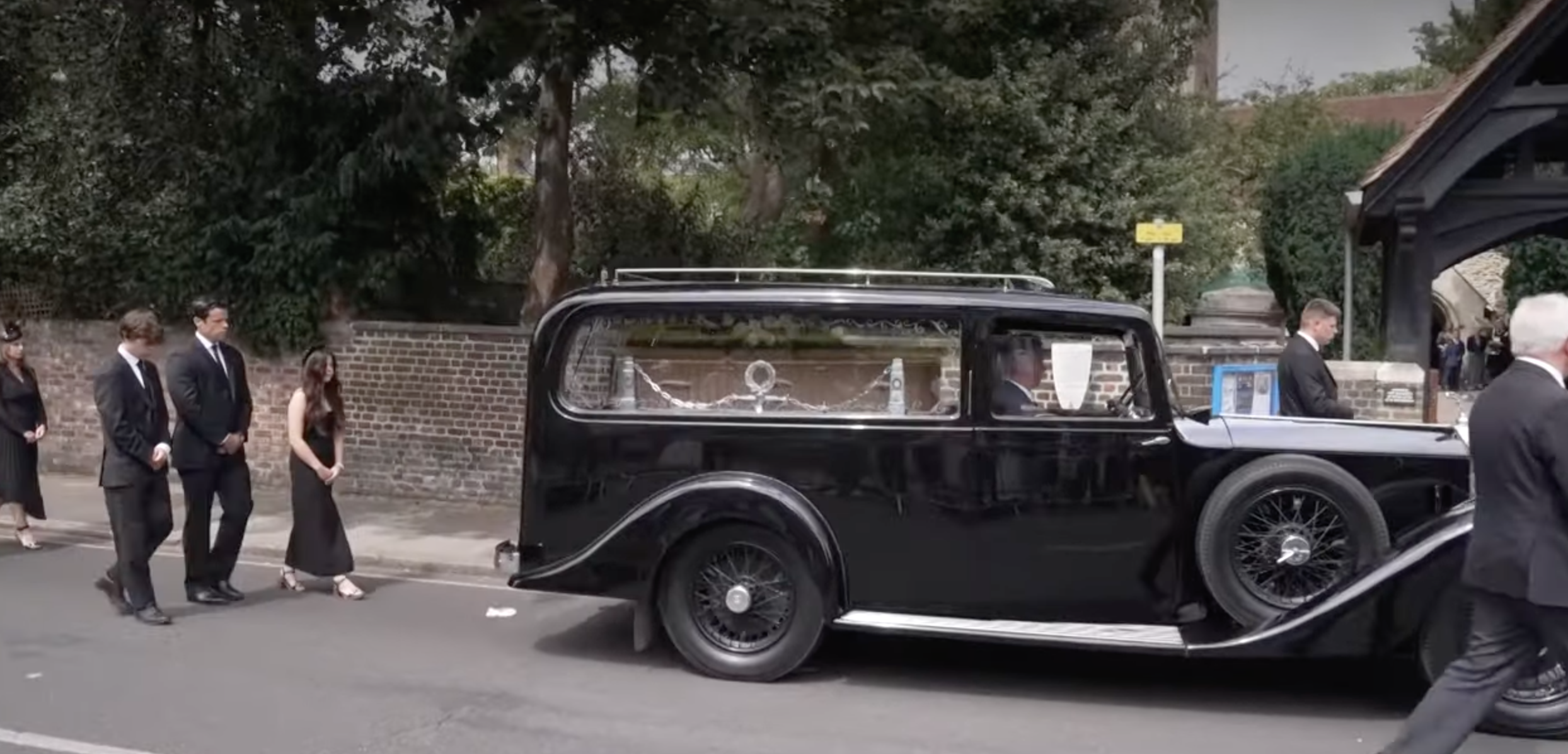 Dame Deborah James' family walk behind her coffin