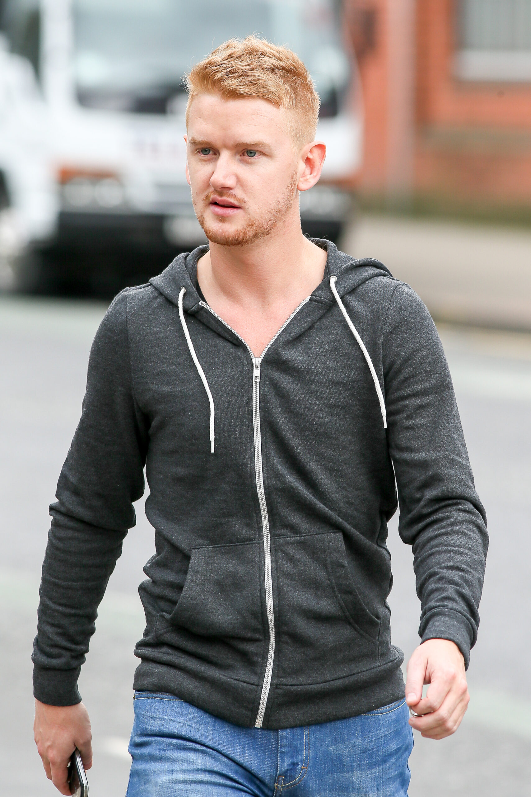Mikey North seen walking through Manchester city centre after filming scenes for Coronation Street.