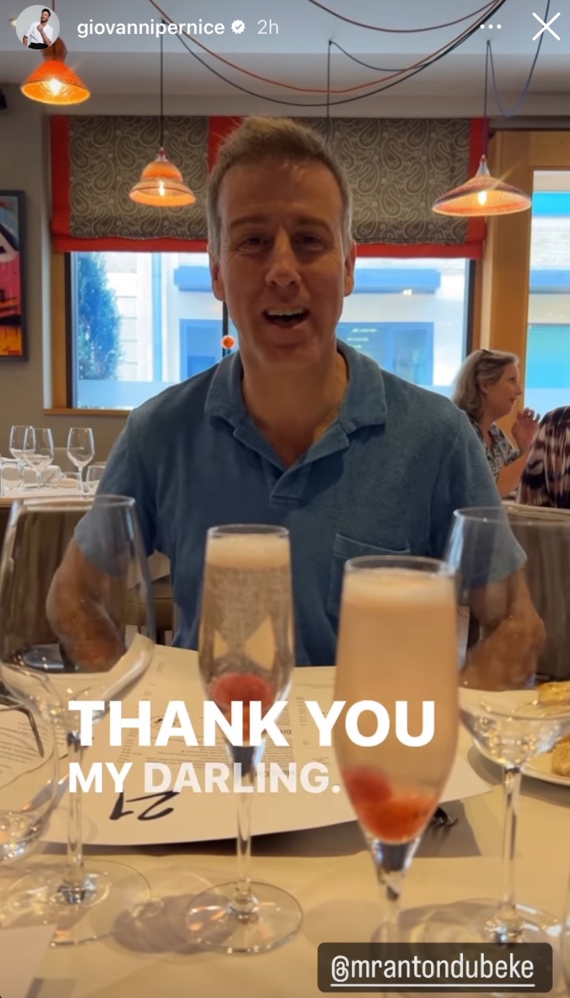 Anton du Beke smiling and having a glass of champagne