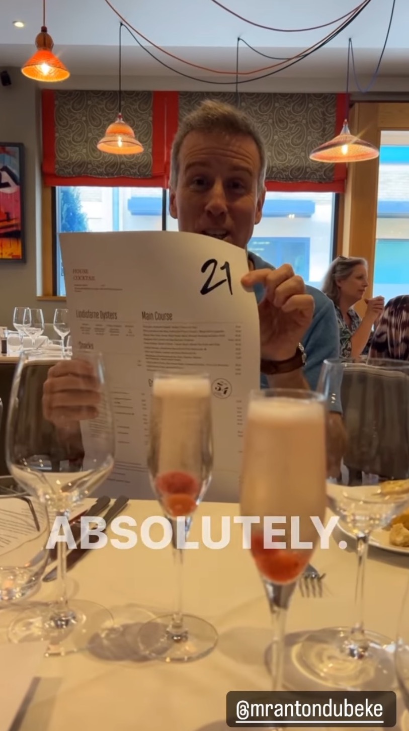 Anton du Beke smiling and having a glass of champagne