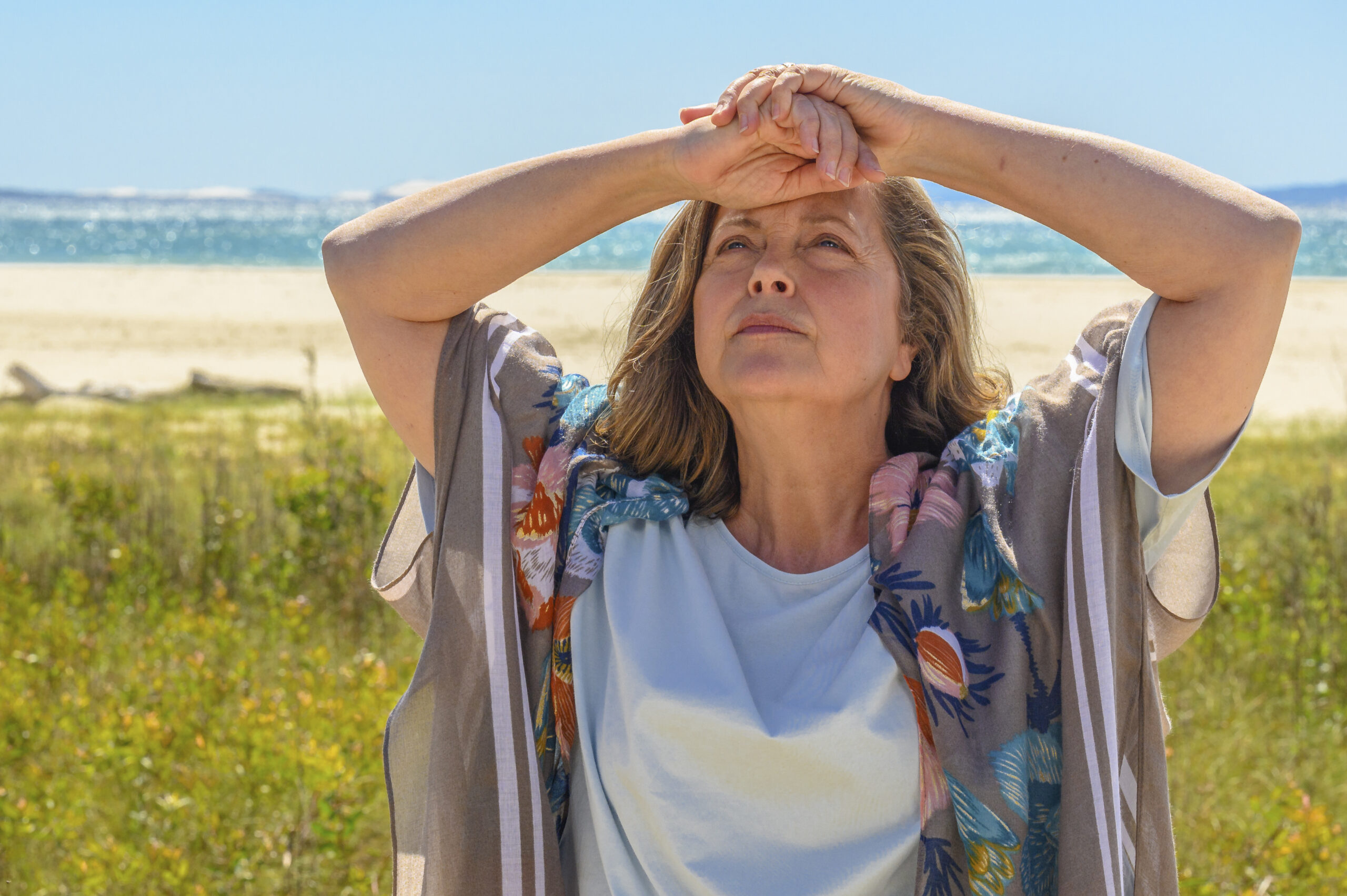 Greta Scacchi as Joan in Darby and Joan. She looks stressed with her hands on her head.