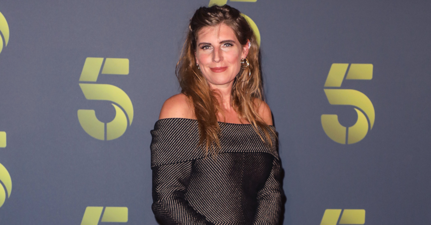 Amanda poses for photos in off the shoulder dress