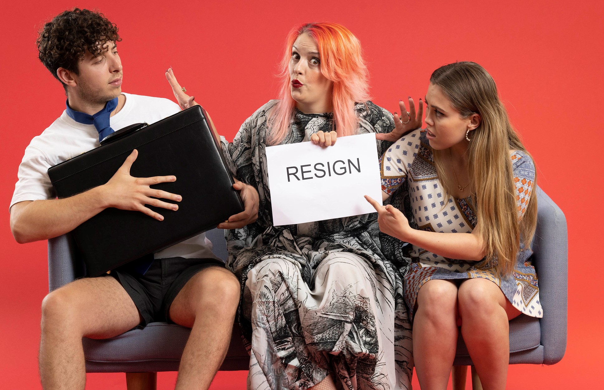 Daniel Constantinou, Sex and relationship expert Alix Fox and Jessica Gaynor holding up 'resign' sign