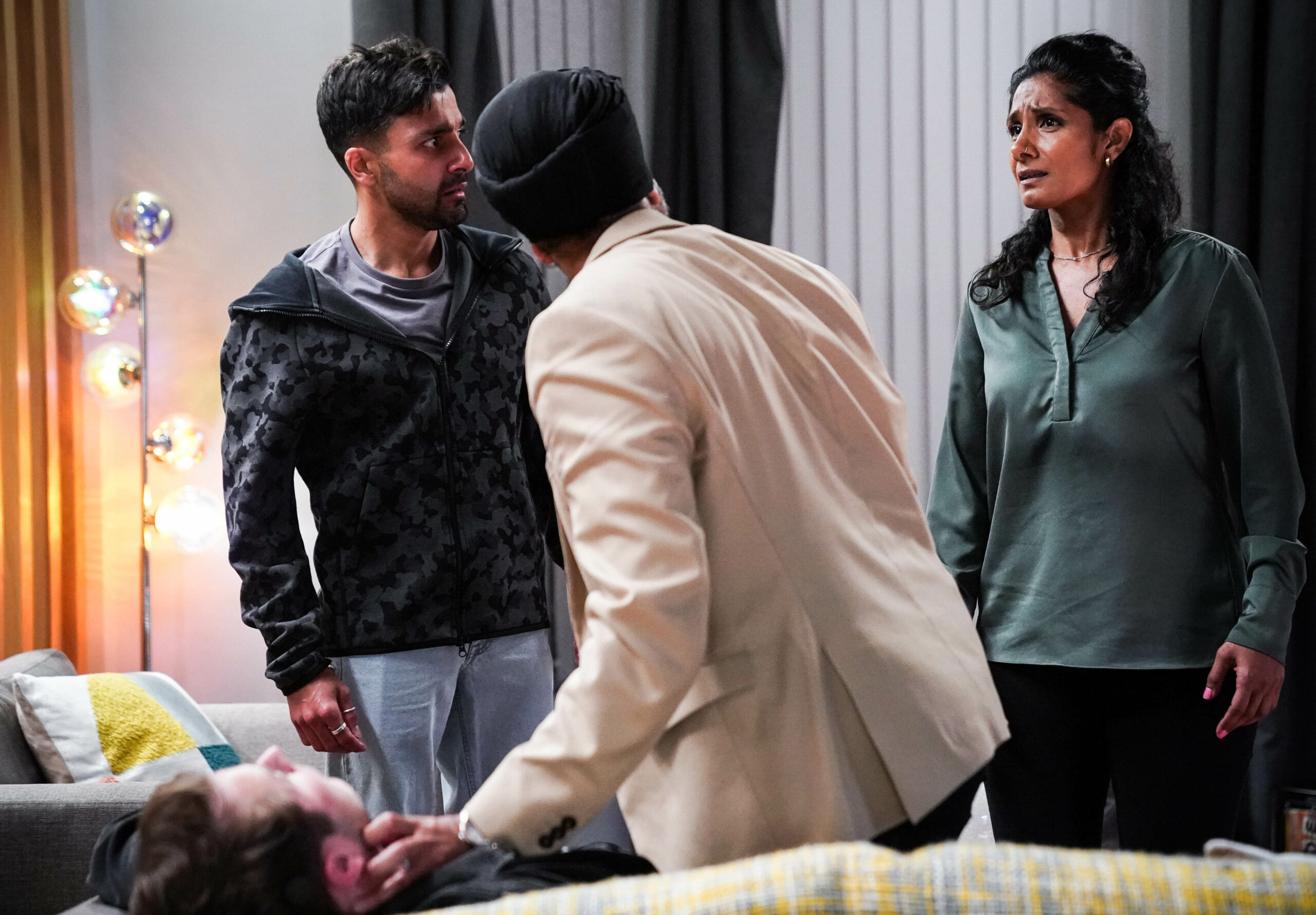 The Panesar family gather around Ben on Eastenders