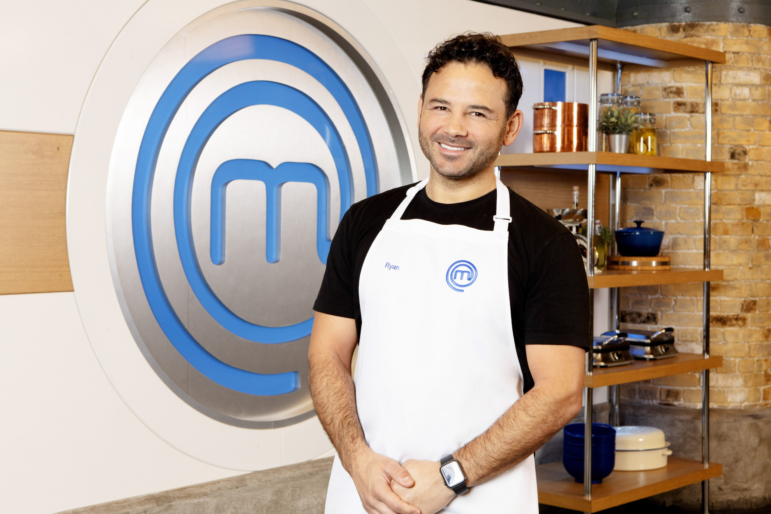 Ryan Thomas next to the masterchef logo