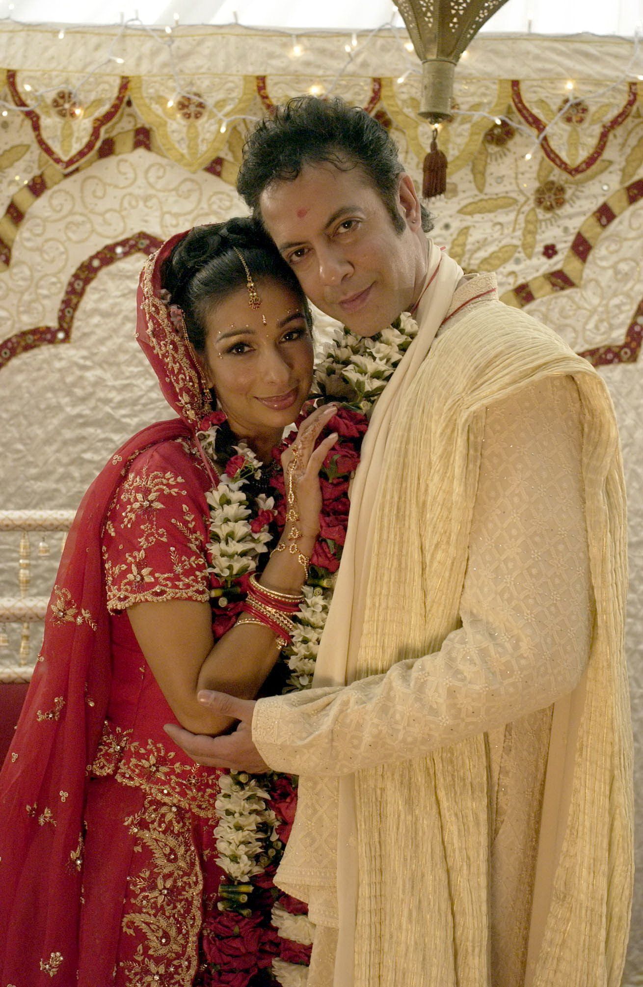 Coronation Street Sunita and Dev Alahan smile at their wedding