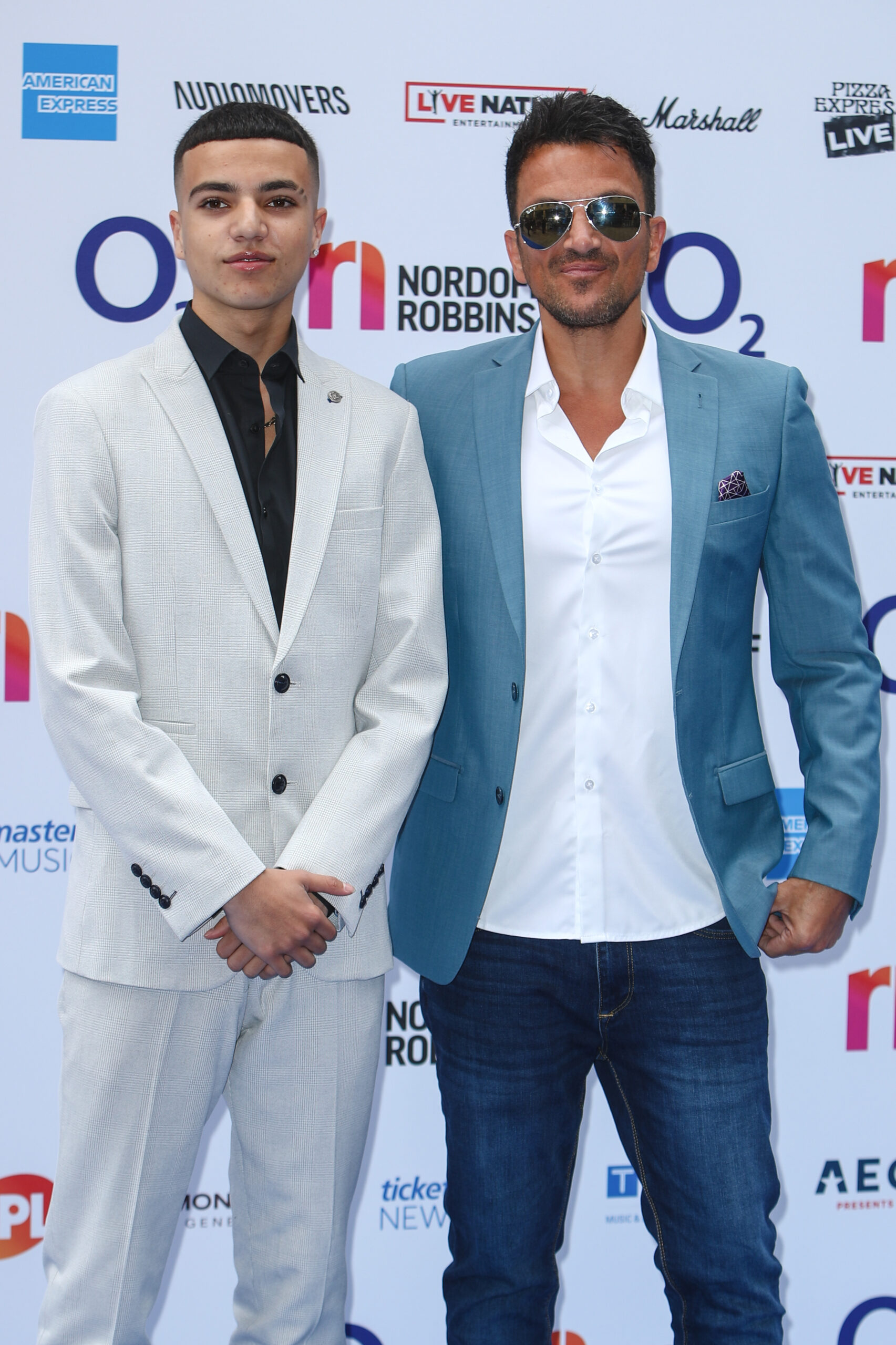 Peter Andre posing with his son Junior