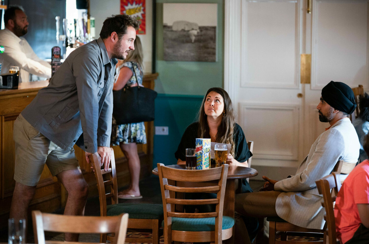 Martin Fowler Stacey Slater and Kheerat Panesar in a cafe