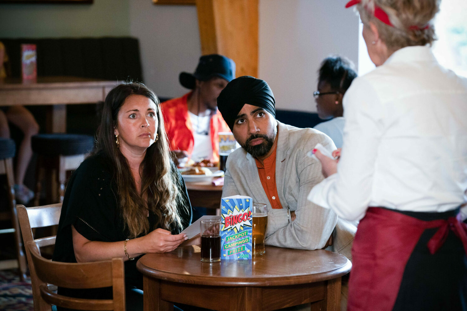 Martin Fowler Stacey Slater and Kheerat Panesar in a cafe are shocked Jean Slater in the waitress