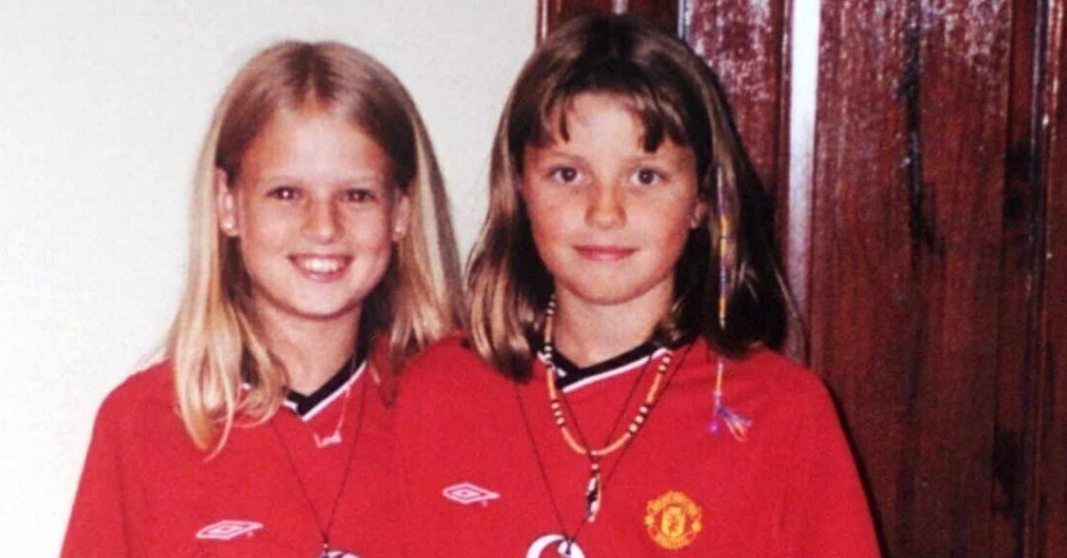 Holly and Jessica wearing matching Manchester United tops