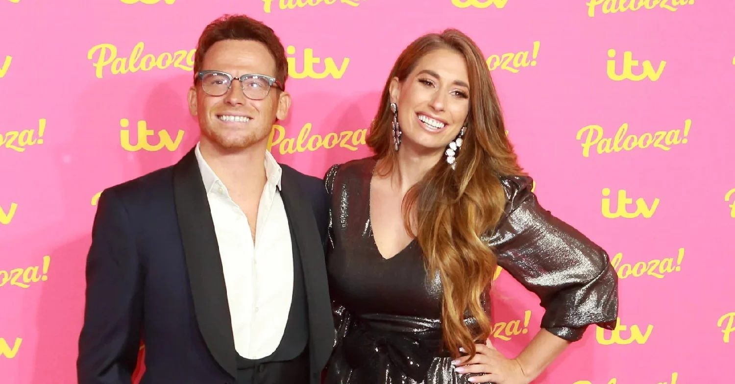 Joe Swash and Stacey Solomon smiling on the red carpet