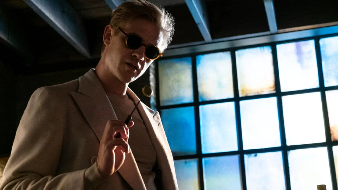 The Sandman, or 'Dream' peers over someone with a wand and sunglasses on