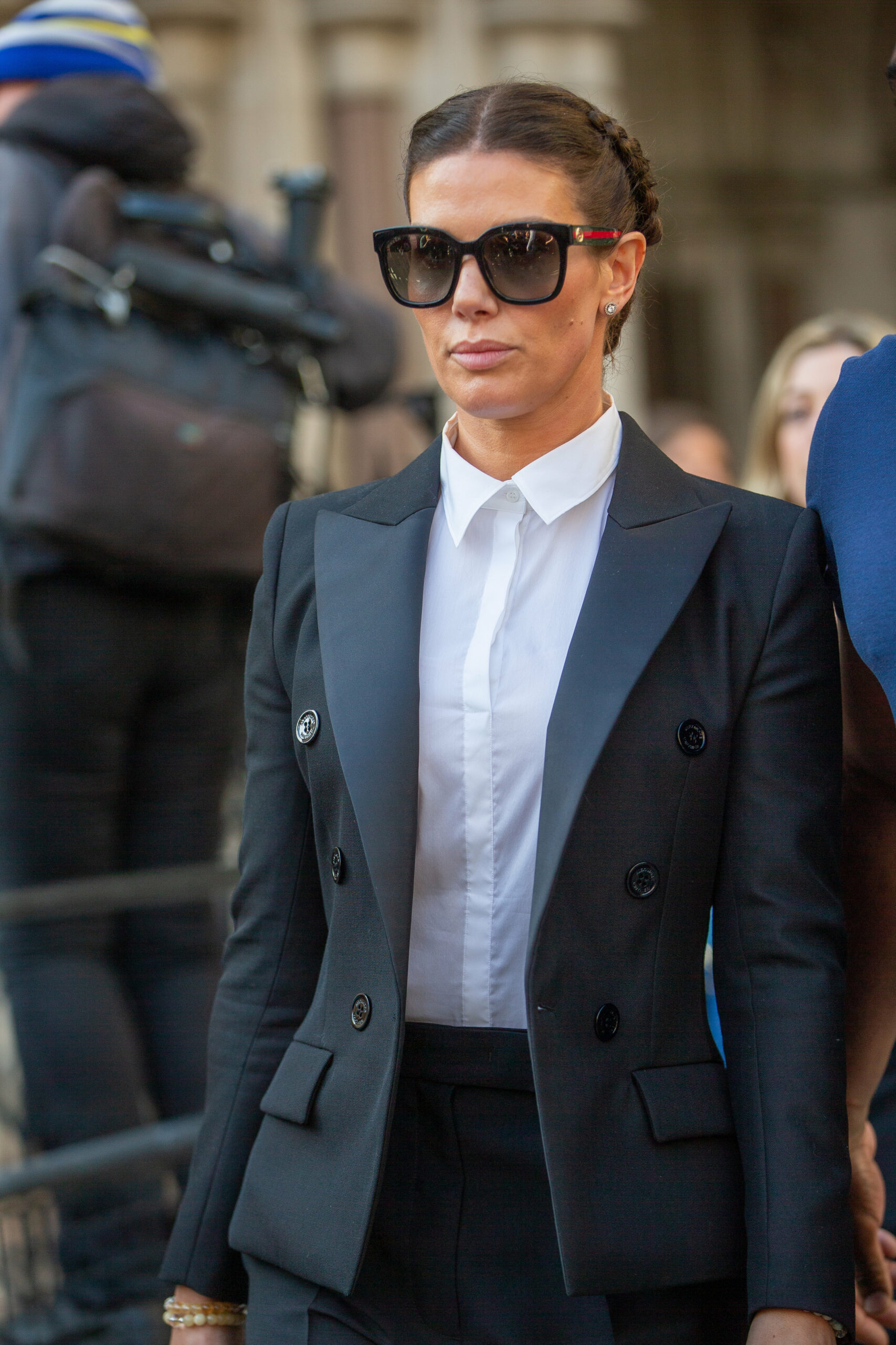 Rebekah Vardy looks downcast as she arrives at court for the libel case wearing sunglasses