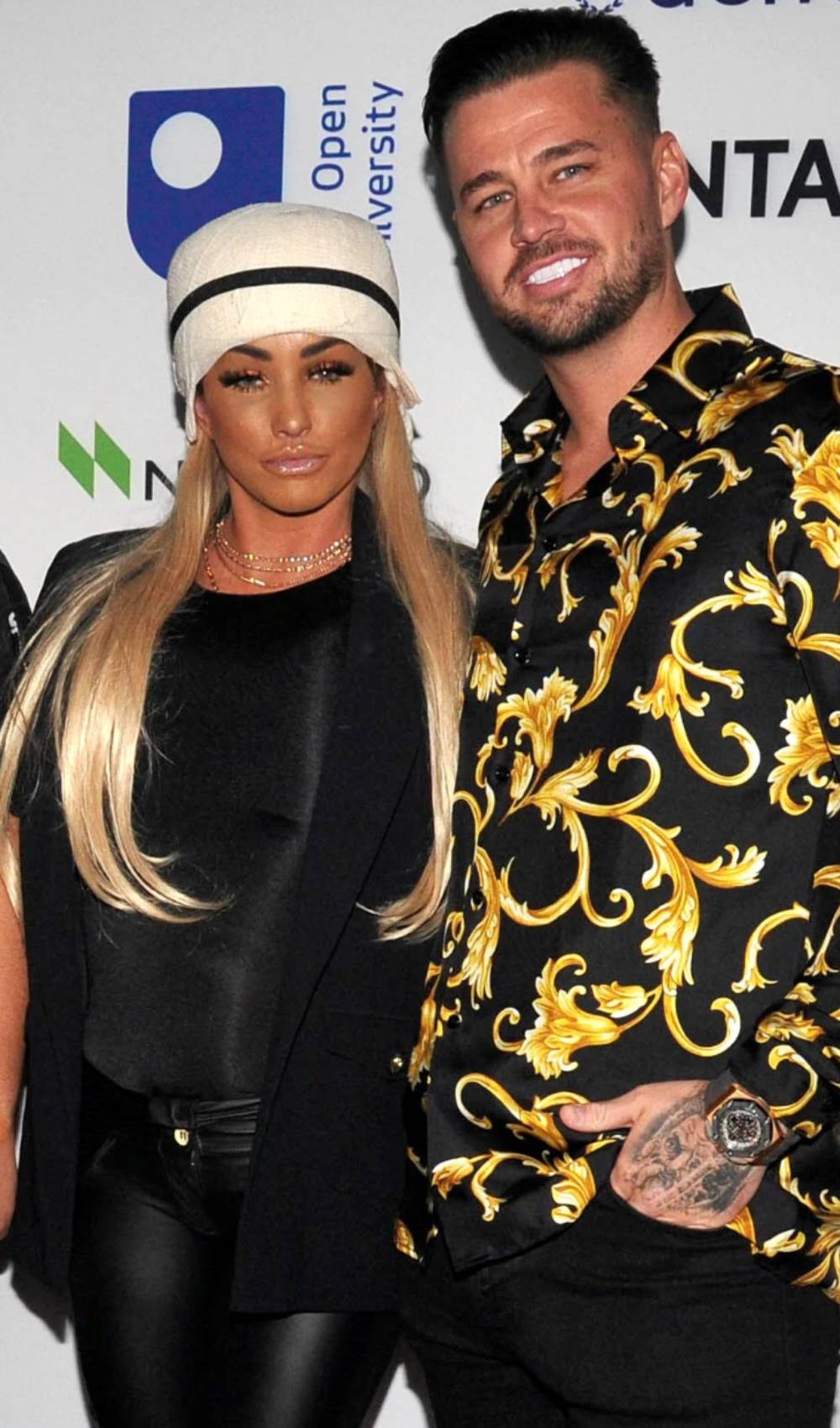 Katie Price and Carl Woods work the red carpet