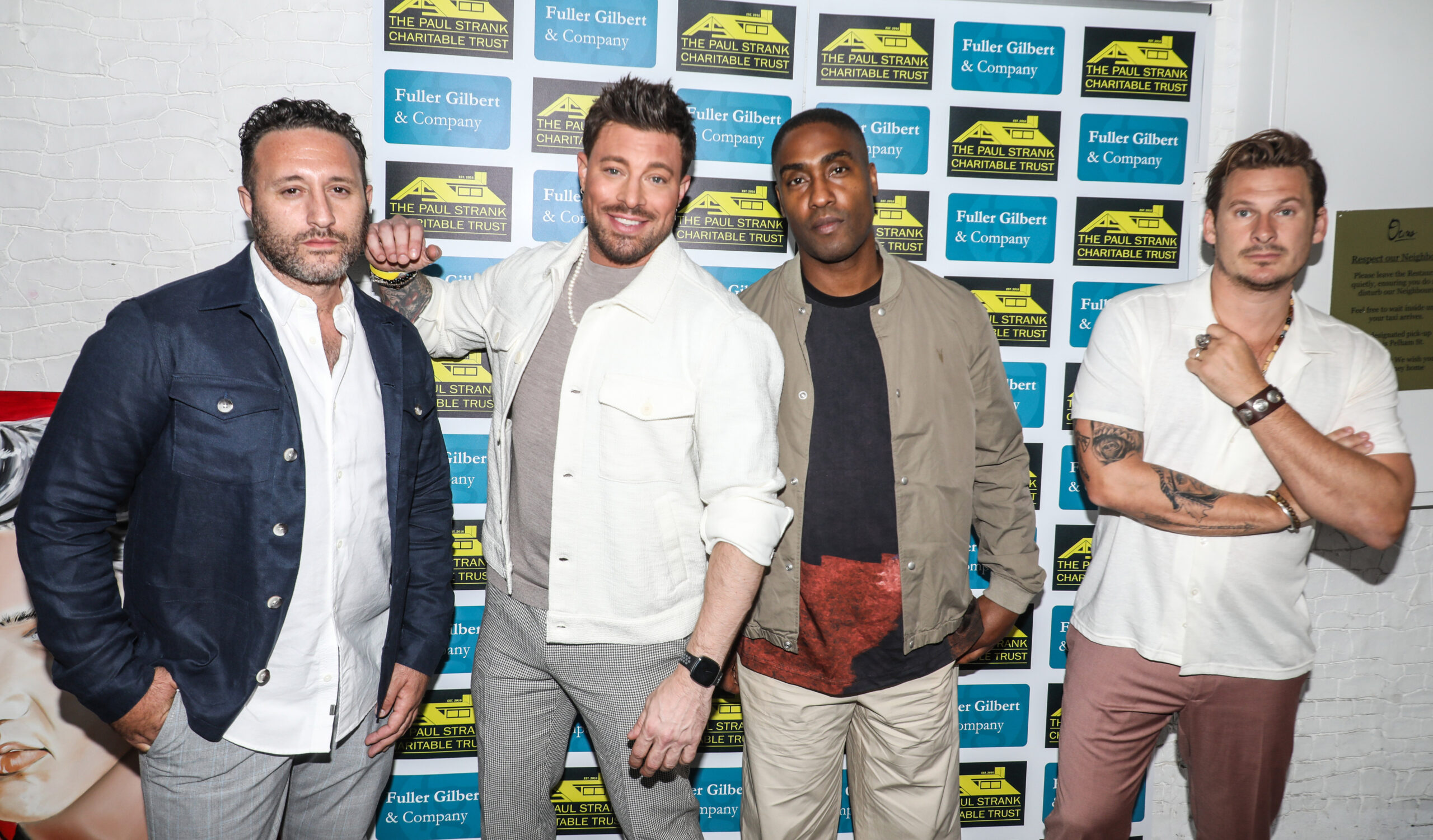 The boy band Blue posing at a party