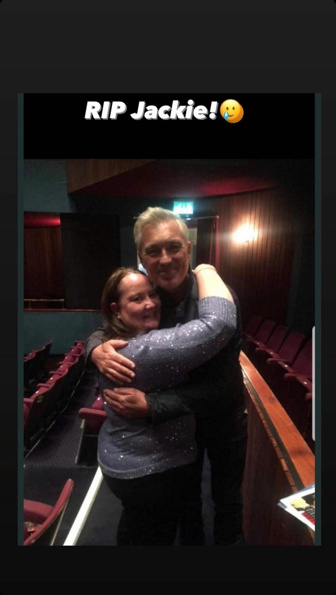 Martin Kemp hugging fan Jackie. White text reads 'RIP Jackie'.