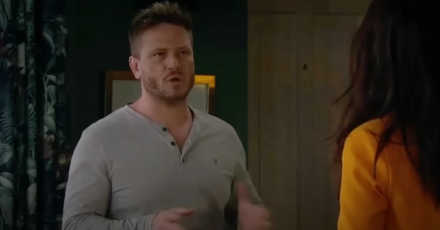 David Metcalfe grey jumper talking to Leyla in Emmerdale