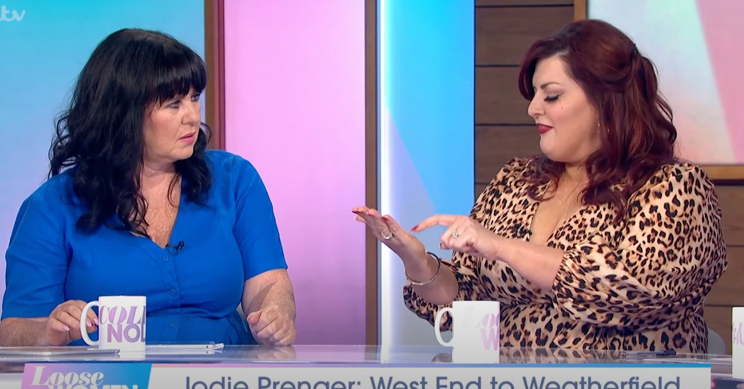 Coleen Nolan and Jodie Prenger on Loose Women panel talking with mugs on desk