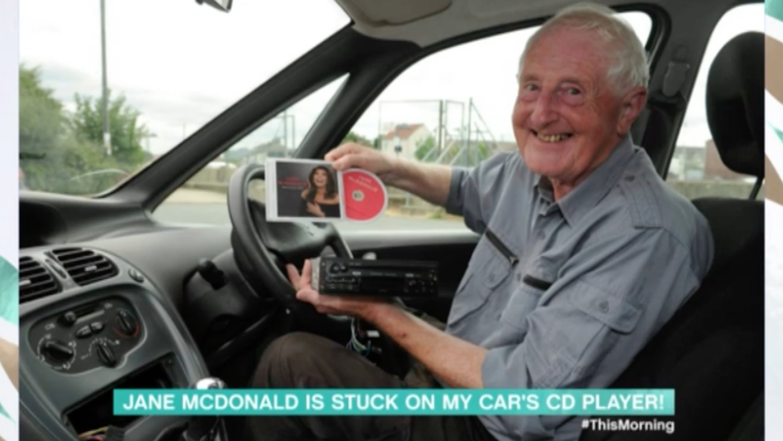 John in his car with his Jane McDonald CD