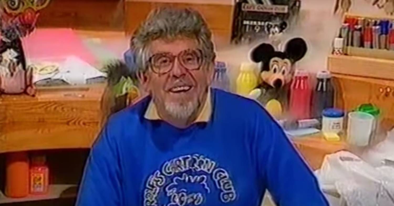 Rolf Harris speaks to the camera during an episode of Rolf's Cartoon Club
