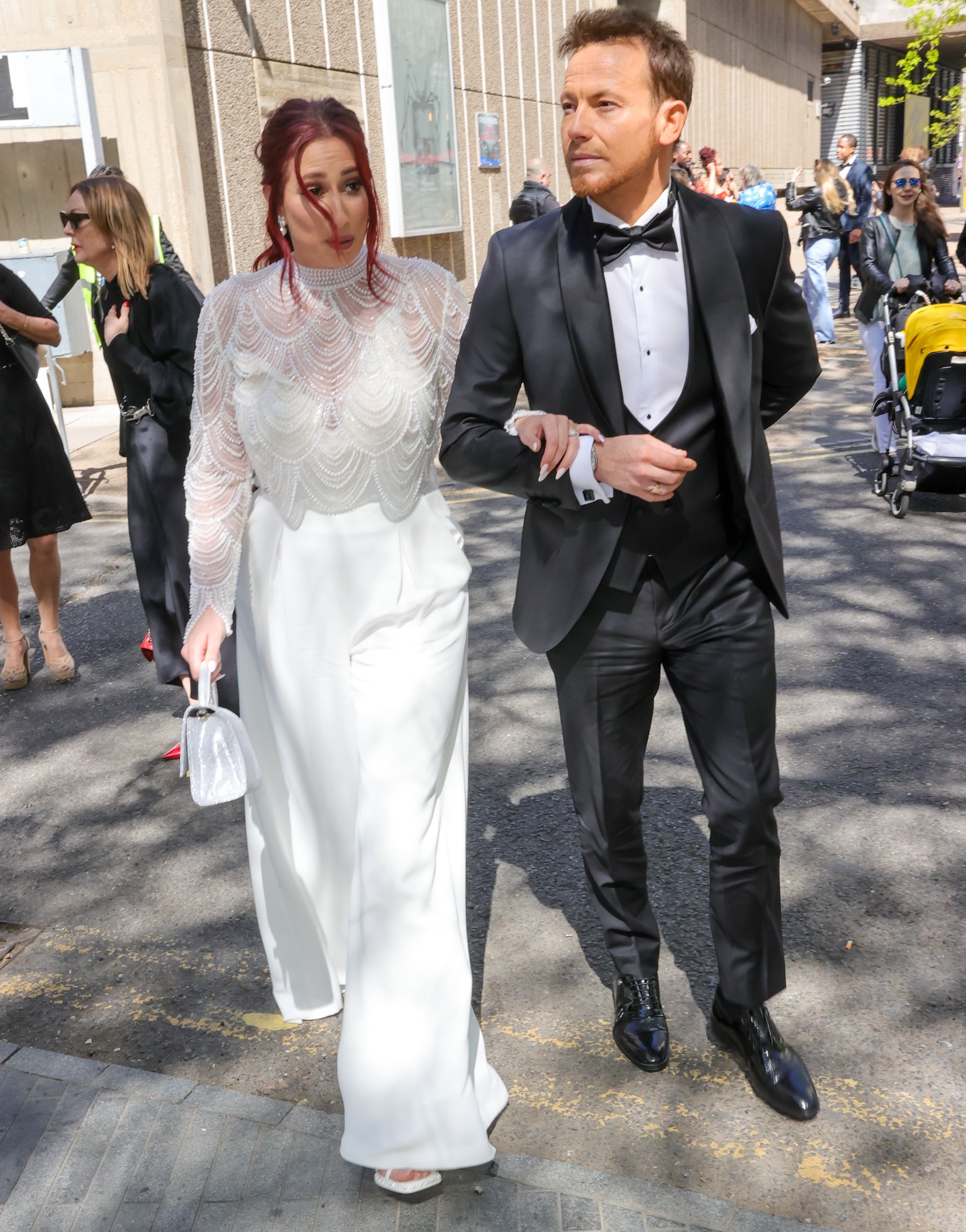 Stacey Solomon and Joe Swash walking arm in arm at event