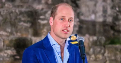 Prince William speaking into a microphone