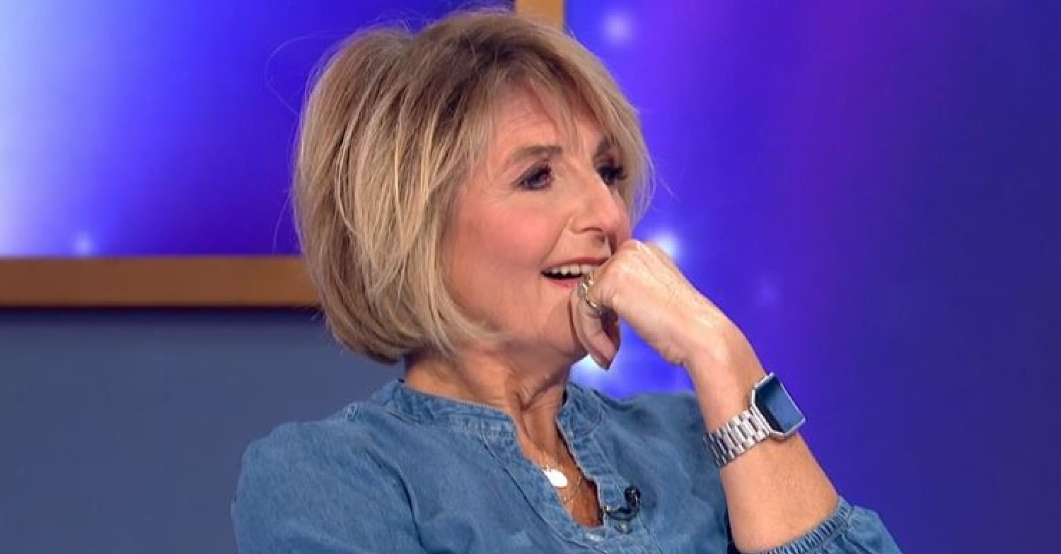 Kaye Adams rests her hand on her chin on Loose Women