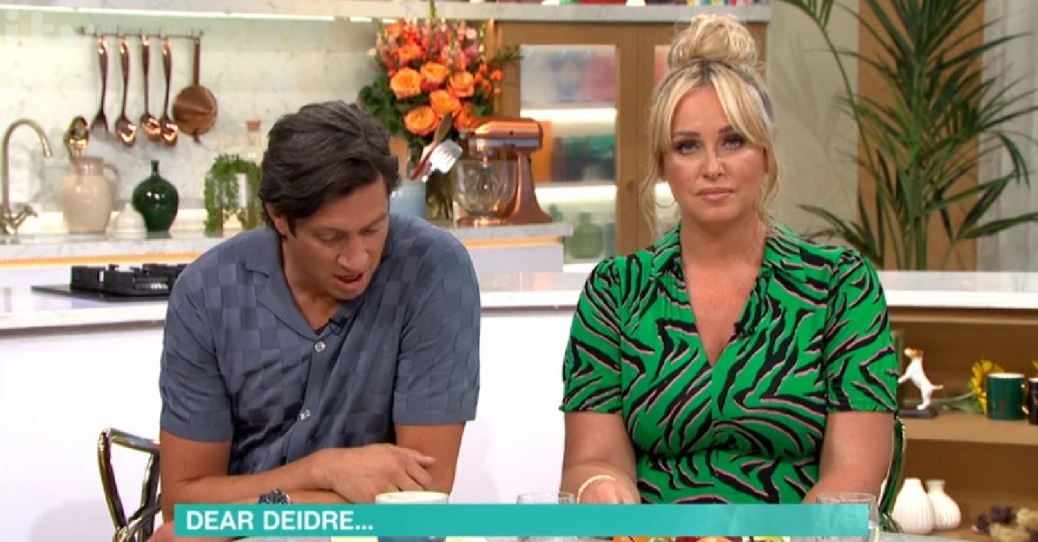 Vernon Kay looks down next to Josie Gibson on This Morning today